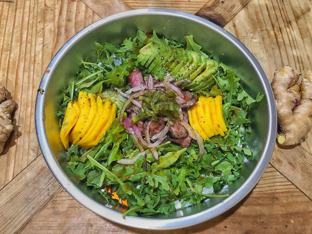 Conscious cuisine — arugula mango avocado salad
