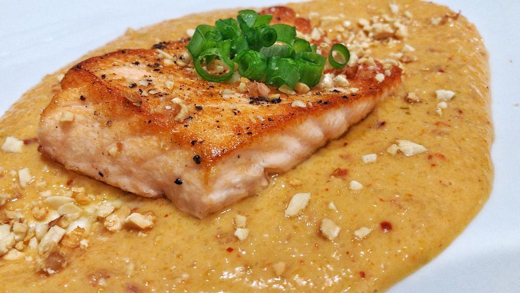 Seared salmon with roasted pepper sauce